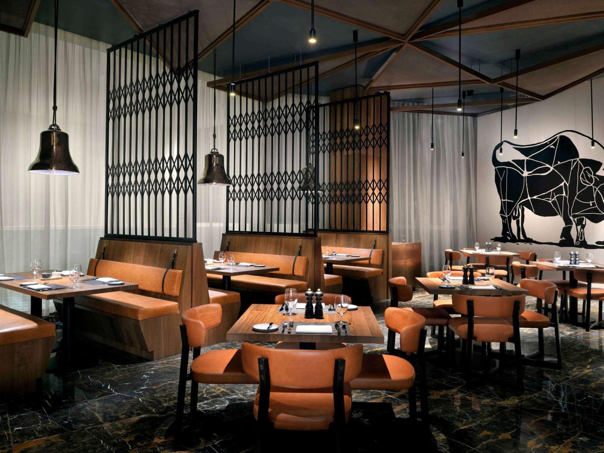 Moevenpick Hotel & Apartments Ghala 马斯喀特 外观 照片 The interior of a typical restaurant
